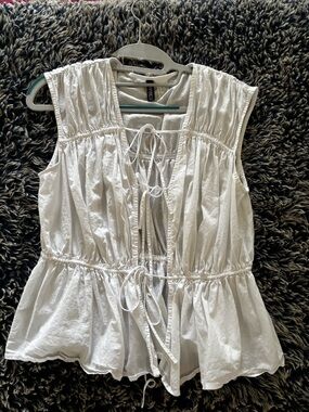 Divided White Sleeveless Peplum Tie-Front Blouse